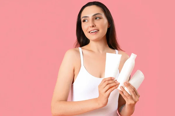 Young Woman Bottles Sunscreen Cream Pink Background — Stock Photo, Image