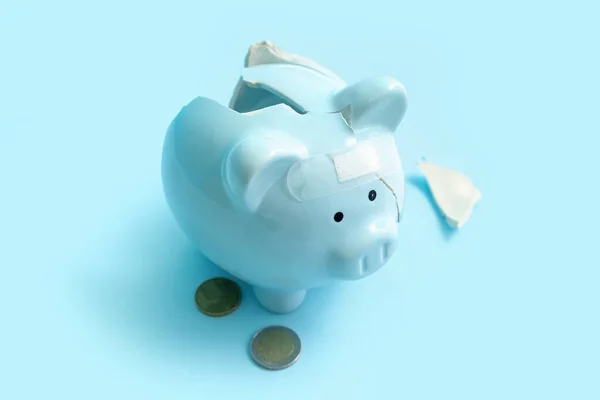 Broken Patched Piggy Bank Money Blue Background Bankruptcy Concept — Stock Photo, Image