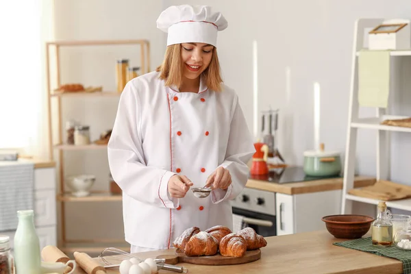 Female Baker Sprinkling Croissants Sugar Powder Table Kitchen — Foto Stock