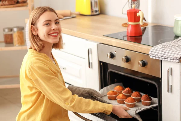 Young Woman Taking Tray Cupcakes Oven Kitchen — 스톡 사진