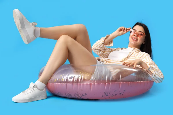 Young Woman Inflatable Ring Lying Blue Background — Stock Photo, Image