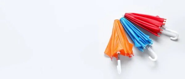 Different Mini Umbrellas Light Background Space Text — Stock Photo, Image
