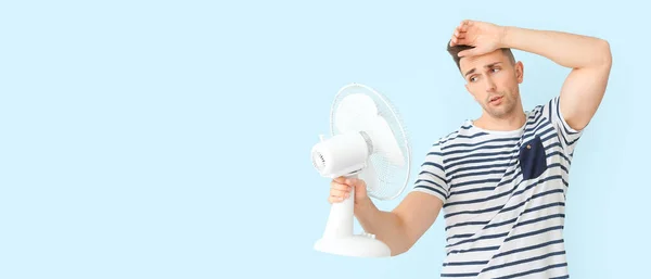 Young Man Electric Fan Light Blue Background Space Text — Stock Photo, Image
