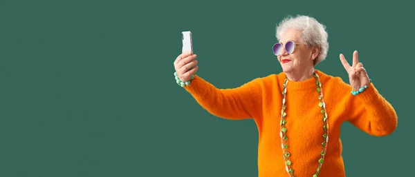 Stylish Senior Woman Taking Selfie Green Background Space Text — Stock Photo, Image