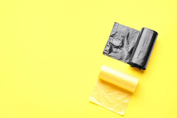 stock image Different rolls of garbage bags on yellow background