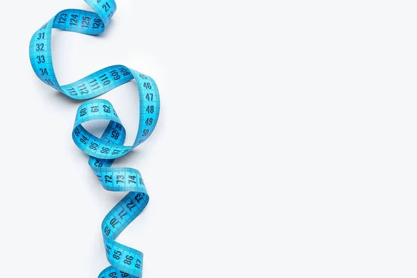 stock image Blue measuring tape on light background, closeup