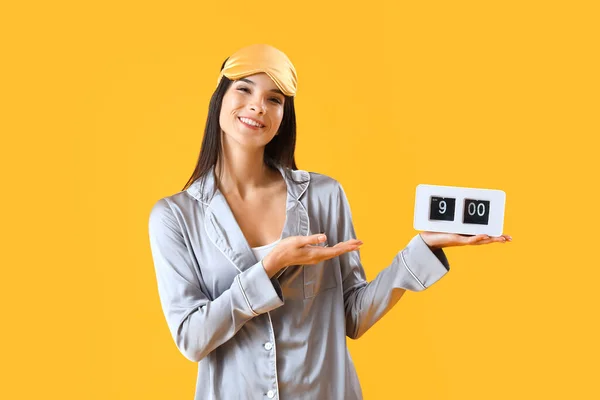 Young Woman Pajamas Alarm Clock Yellow Background — Stock Photo, Image