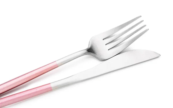 白の背景にピンクハンドル付きステンレス製のフォークとナイフ — ストック写真