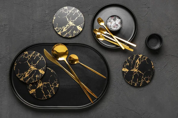 Clean Plates Drink Coasters Golden Cutlery Black Grunge Table — Stock Photo, Image