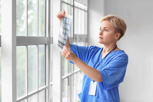 stock image Female medical intern with x-ray scan in clinic