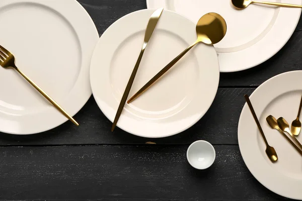 Clean Plates Set Golden Cutlery Black Wooden Table — Stock Photo, Image