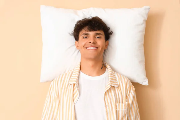 Young Man Pillow Beige Background — Stock Photo, Image
