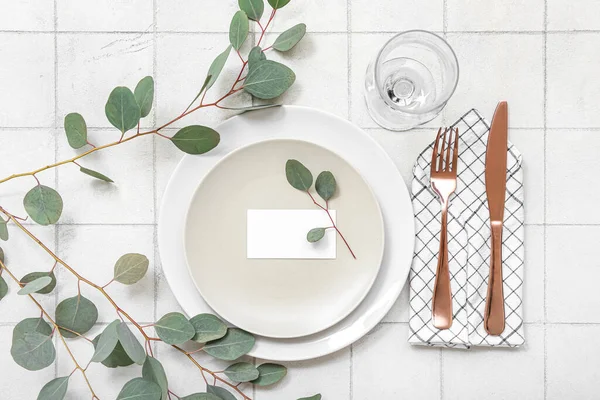 Beautiful Table Setting Blank Invitation Card Eucalyptus Branches White Tiled — Stock Photo, Image