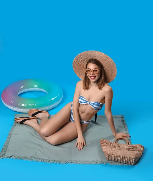 Young Woman Swimsuit Sitting Blue Background — Stock Photo, Image