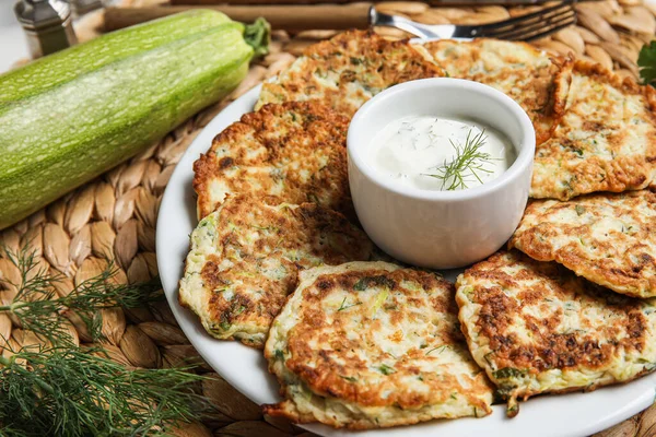 Plate Tasty Zucchini Fritters Sour Cream Table — Stock Photo, Image