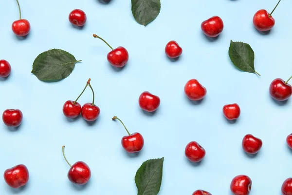 Stock image Many sweet cherries on blue background