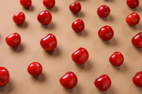 stock image Many sweet cherries on brown background