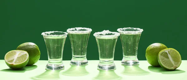Shots Tasty Tequila Limes Green Background — Stock Photo, Image