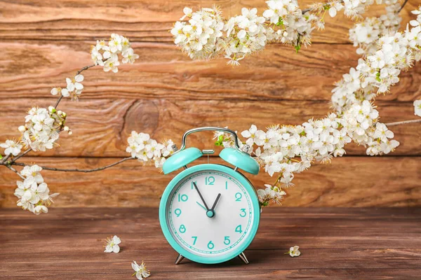 Blooming Spring Branches Turquoise Alarm Clock Wooden Background — Stock Photo, Image