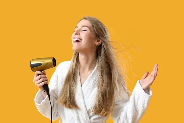 Young Blonde Woman Hair Dryer Yellow Background — Stock Photo, Image