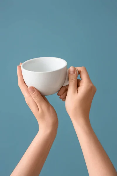 Female Hands Holding Cup Blue Background — Stock Photo, Image