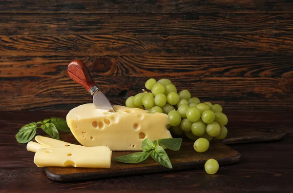 Board Tasty Swiss Cheese Grapes Wooden Background — Stock Photo, Image
