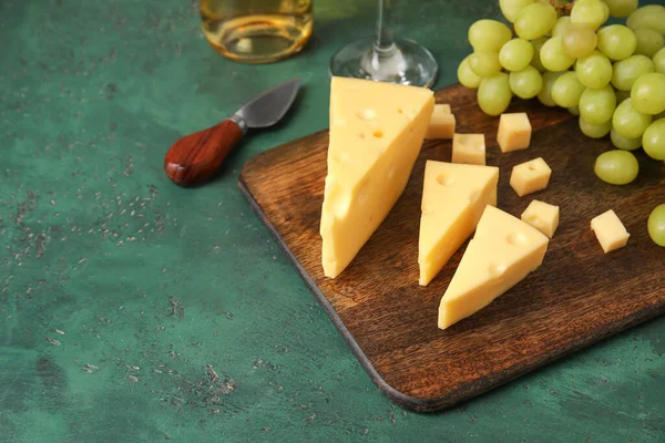 Wooden Board Tasty Swiss Cheese Green Background — Stock Photo, Image