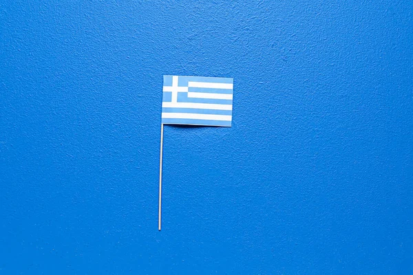 Bandera Papel Grecia Sobre Fondo Azul —  Fotos de Stock