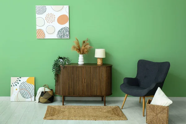 Stylish Interior Living Room Drawers Armchair Paintings Wicker Rug — Stock Photo, Image