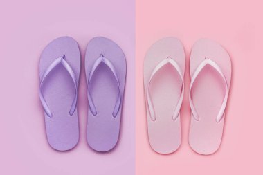 Renkli arka planda pembe ve leylak parmak arası terlikler