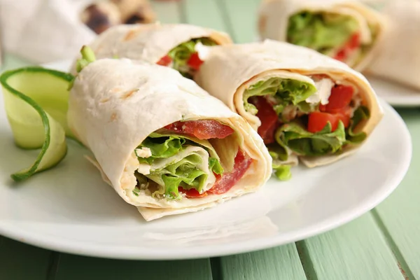 Plate Tasty Lavash Rolls Tomatoes Greens Green Wooden Background — Stock Photo, Image