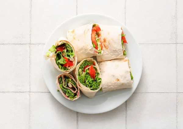 Plate Tasty Lavash Rolls Tomatoes Greens White Tile Background — Stock Photo, Image