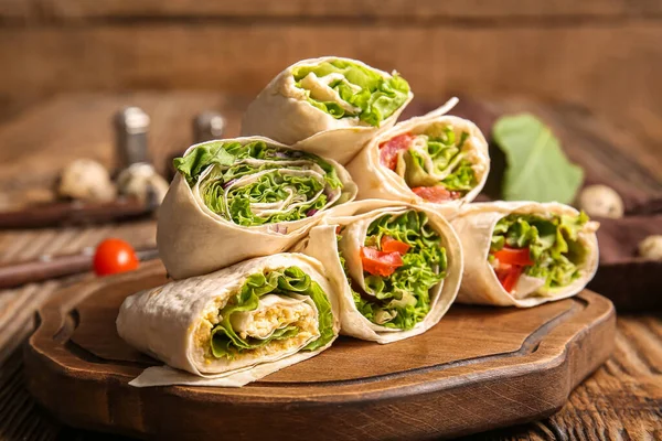 Board Tasty Lavash Rolls Vegetables Greens Wooden Background — Stock Photo, Image