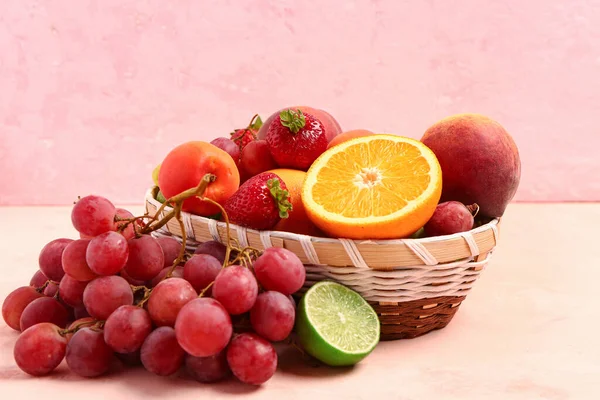 Wicker Bowl Different Fresh Fruits Pink Background — Stock Photo, Image