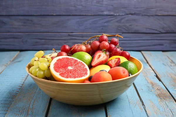 Bowl Different Fresh Fruits Blue Wooden Background — Stock Photo, Image