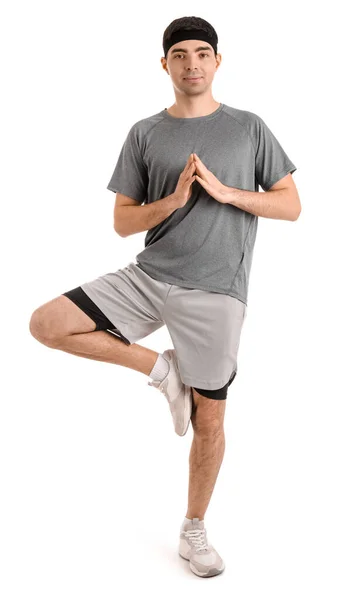 Sportos Fiatalember Meditál Fehér Háttérrel Egyensúly Fogalma — Stock Fotó