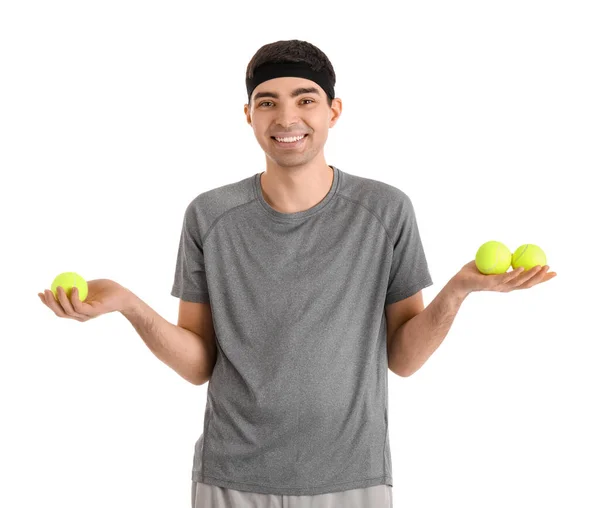 白い背景にテニスボールを持つスポーティ若い男 バランスの概念 — ストック写真