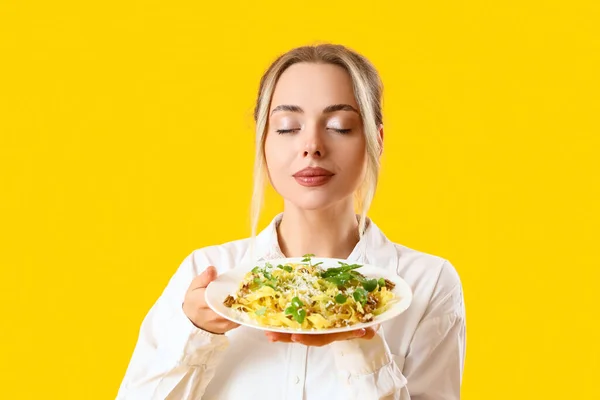 Young Woman Tasty Pasta Yellow Background Closeup — Stock Photo, Image