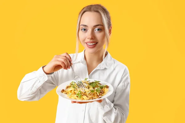 Young Woman Tasty Pasta Yellow Background — Stock Photo, Image