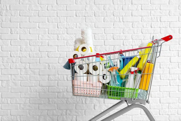 Shopping Cart Full Cleaning Supplies Brick Wall — Stock Photo, Image