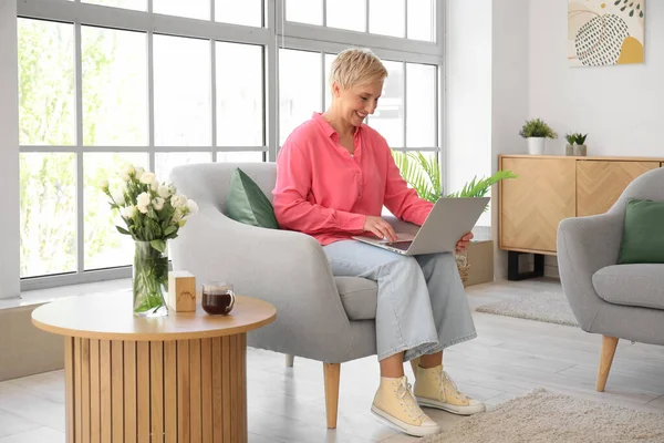 Mature Woman Using Laptop Armchair Home — Stock Photo, Image