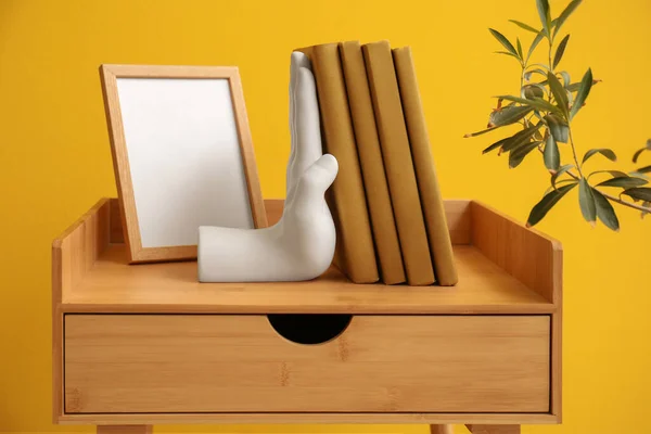 Stylish Bookend Blank Frame Table Yellow Wall — Stock Photo, Image