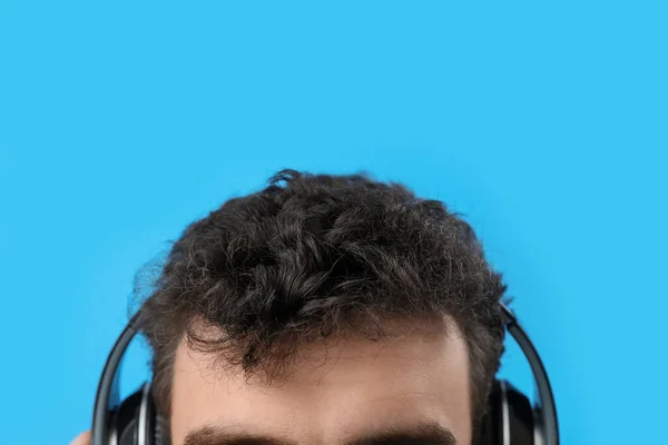Young Brunette Man Headphones Blue Background Closeup — Stock Photo, Image