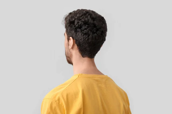 Young Brunette Man Stylish Hairdo Light Background Closeup — Stock Photo, Image
