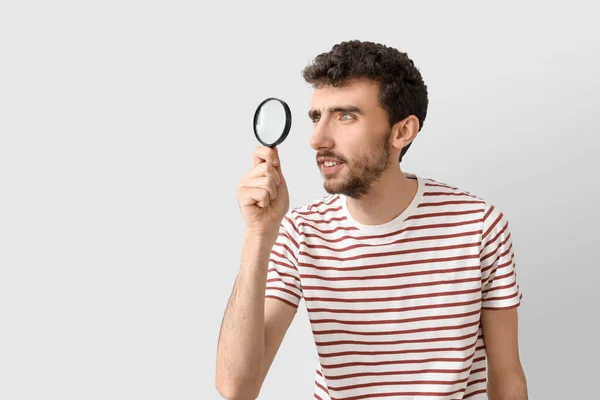Young Man Magnifier Light Background — Stock Photo, Image