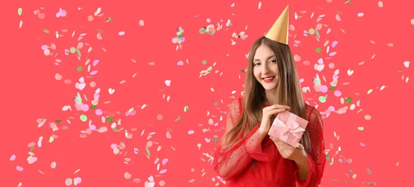 Happy Young Woman Birthday Gift Falling Confetti Red Background Banner — Stock Photo, Image