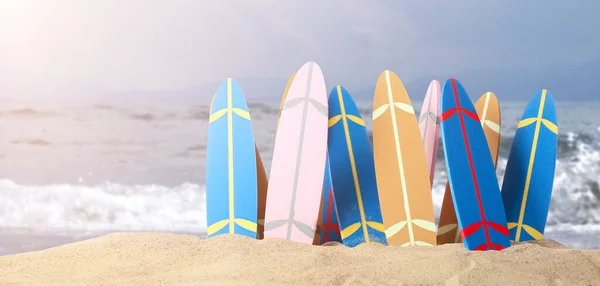 stock image Many small surfboards on beach sand  