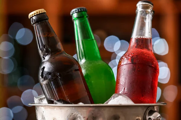 stock image Bucket with bottles of cold beer in bar, closeup