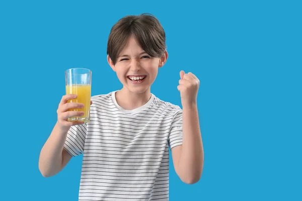 Happy Little Boy Glass Orange Juice Blue Background — Stock Photo, Image