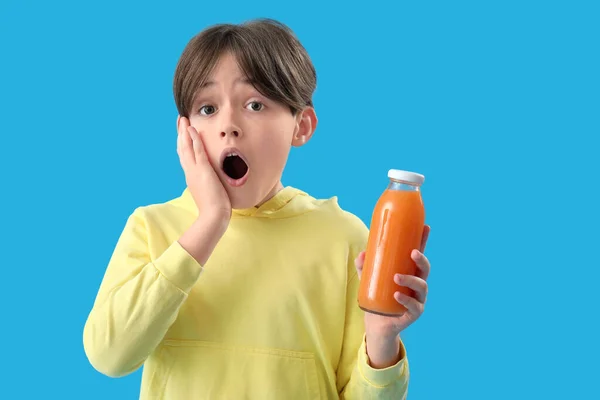 Shocked Little Boy Bottle Orange Juice Blue Background — Stock Photo, Image